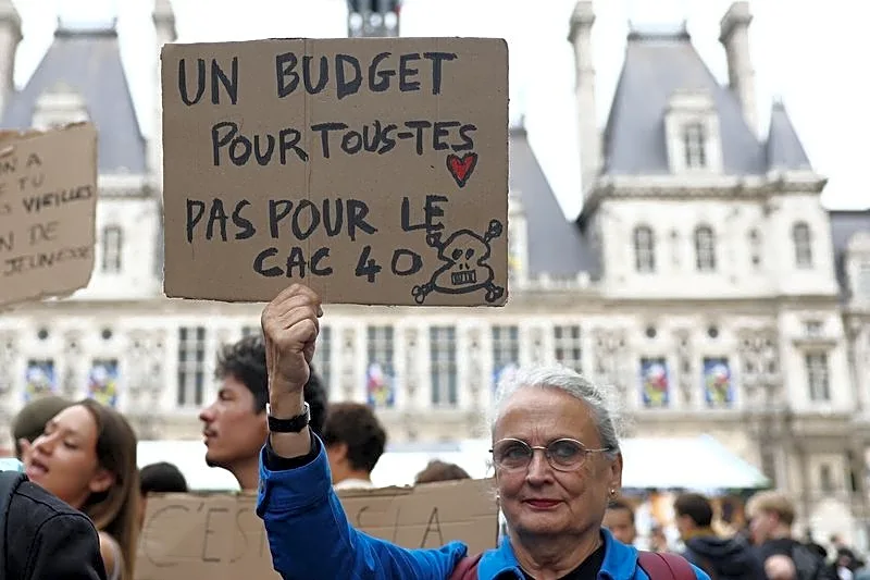 European shares slip on French unrest; earnings in focus