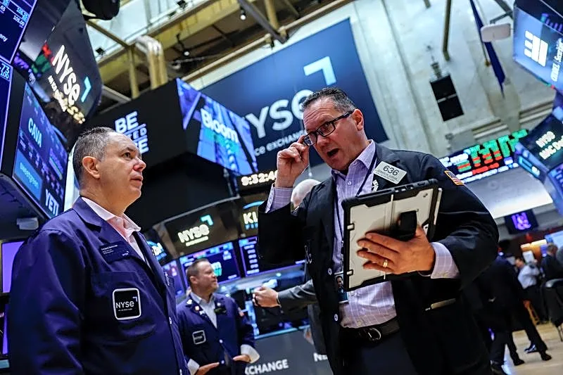 US futures rebound as AI earnings test looms; France pressures Europe