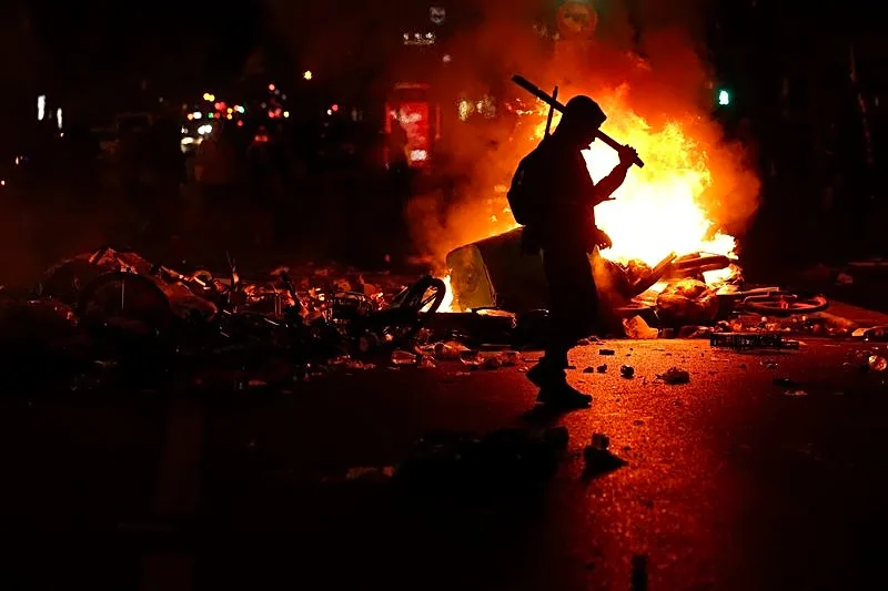 France urges curfews in some areas after weekend of riots