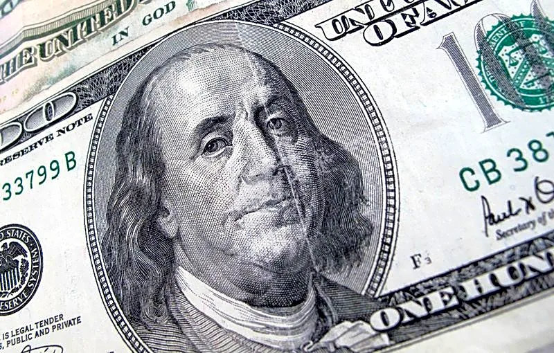 Dollar holds steady as Middle East tensions simmer, oil rises