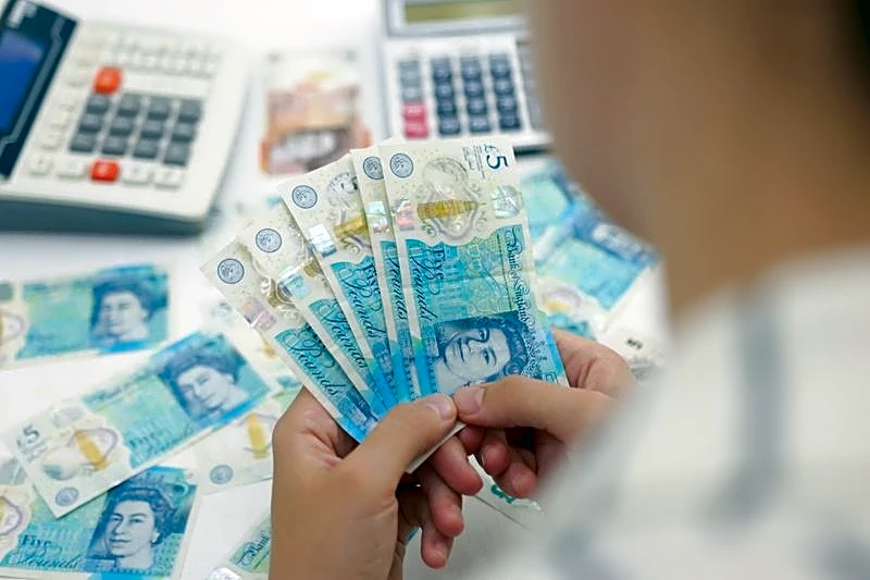 Pound edges higher, outperforming as investor nerves rattle euro zone markets