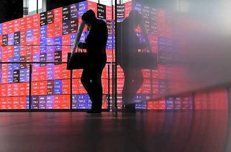 Asian shares wobble as tech rout boosts bonds, dents rate hike bets
