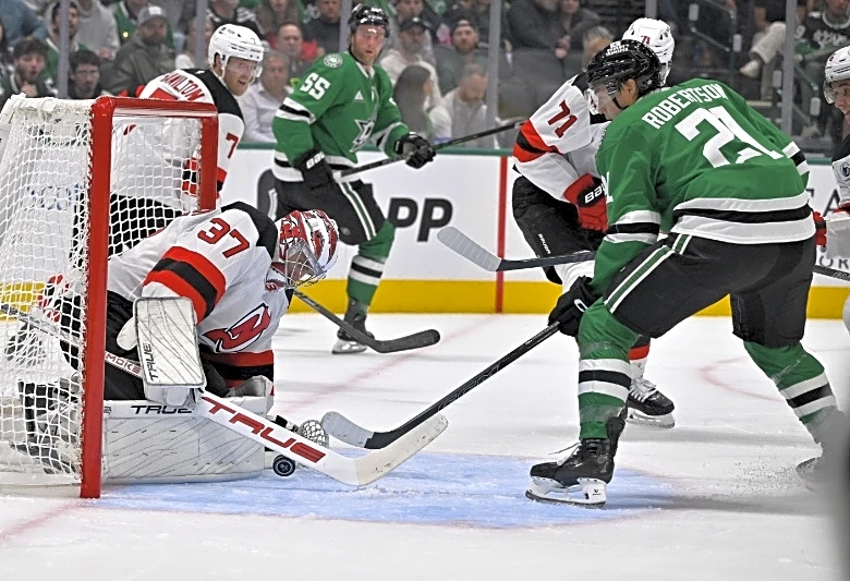 NHL roundup: Connor Hellebuyck shuts down Stars to win Devils debut