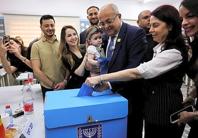 For Israel's Arabs, record turnout may bring political clout