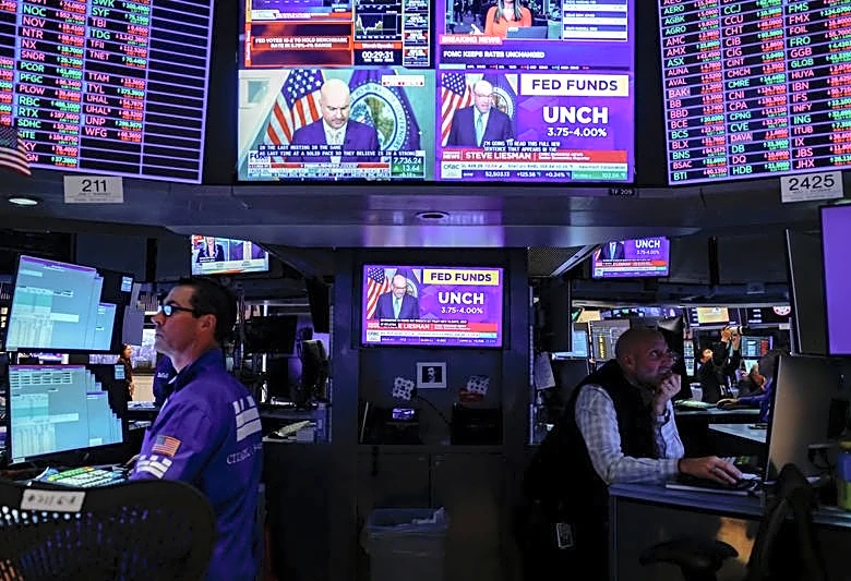 Wall Street mostly rises as Fed holds key rate steady, deferring next likely hike to December