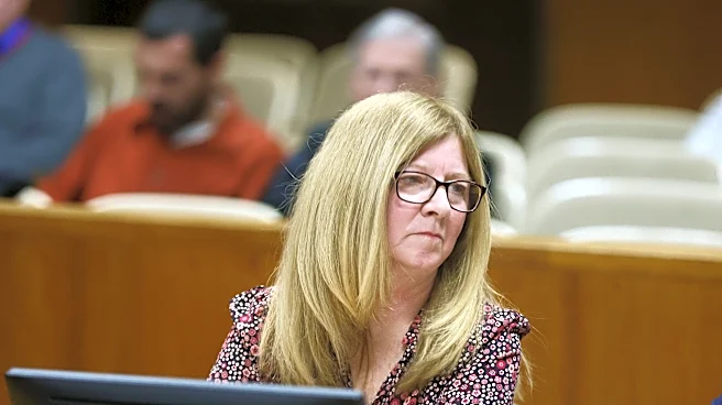 Greece strips health benefits from former official Michelle Marini