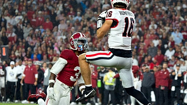 How far did Alabama football fall in US LBM Coaches Poll after Georgia loss?