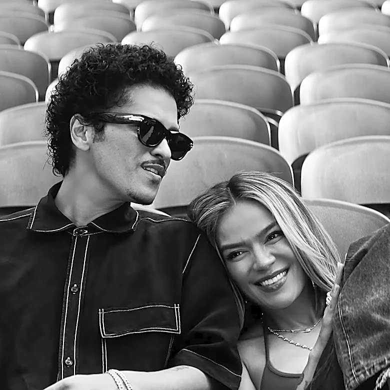 Karol G and Bruno Mars Fill a Stadium With Love in ‘Still’ Video