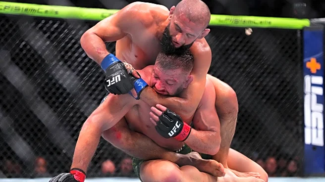 Khamzat Chimaev mauls Dricus du Plessis on the ground to win middleweight title in UFC 319 main event