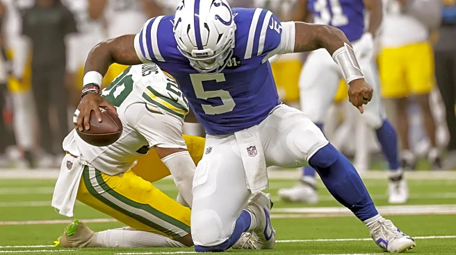 Which Colts quarterback played better against the Packers?