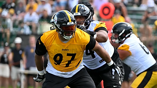 Cam Heyward practices in dress shirt