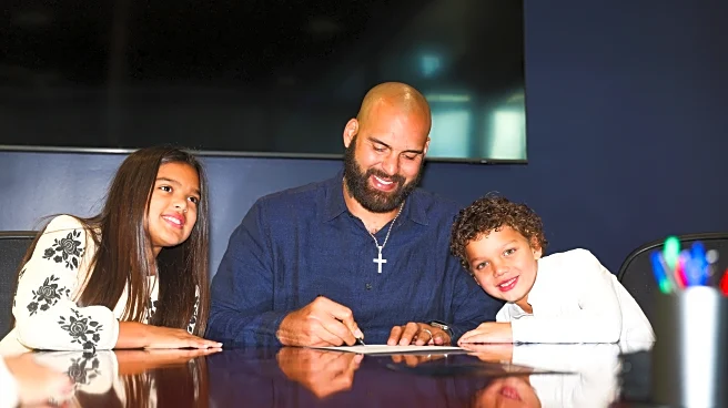 Lawrence Guy signs ceremonial contract to retire a Patriot