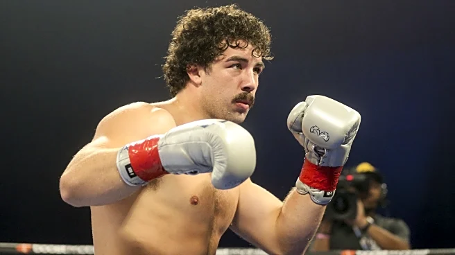 Richard Torrez raises hand for Moses Itauma fight