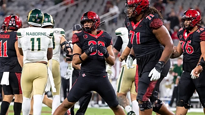 AZTECS RIDE ROUGHSHOD OVER COWBOYS IN 24-7 VICTORY.