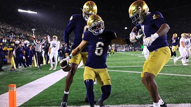 Notre Dame capzizes Navy 49-10 in a wintery mix