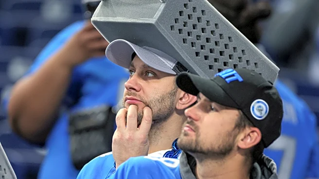 The Bears’ players are all wearing cheese grater hats