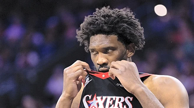 Joel Embiid leaves game with apparent knee injury