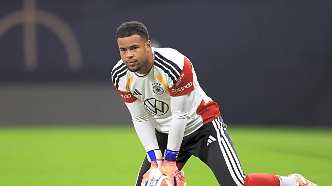 Germany, SC Freiburg GK Noah Atubolu admires Bayern Munich’s Manuel Neuer