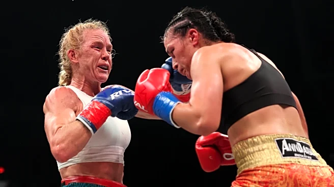 Holly Holm’s bid to win boxing title comes to an end due to accidental bloody headbutt | Video