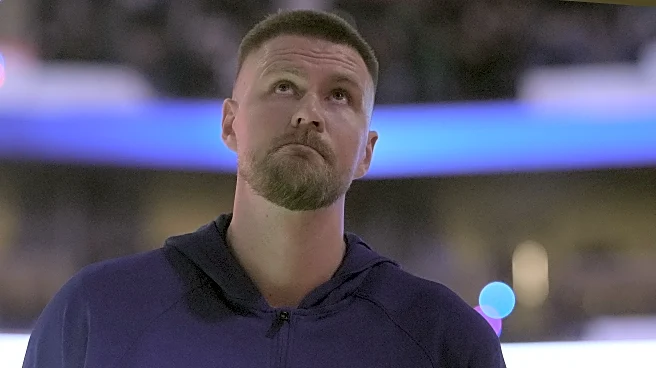 Kristaps Porzingis on team plane, bench