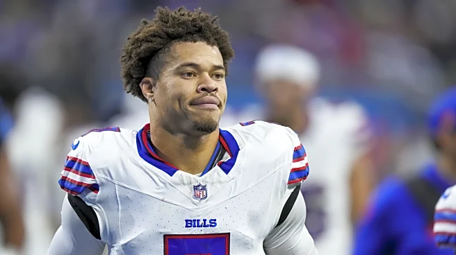 Who competes with Taron Johnson for slot CB role?