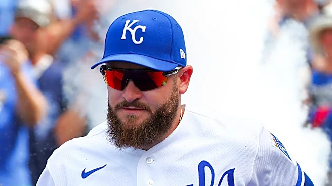 Royal bats shine on a dreary night, beat Minnesota 13-9