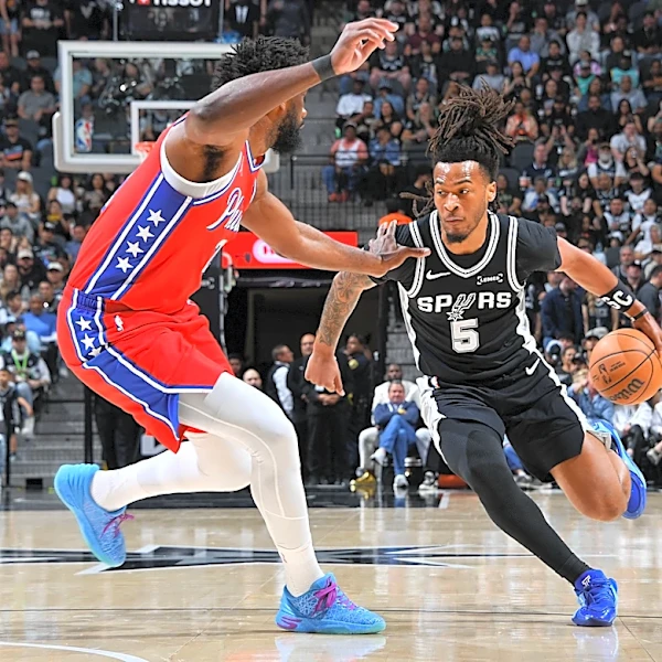 Spurs hold off 76ers for 60th win despite losing Wembanyama to rib injury
