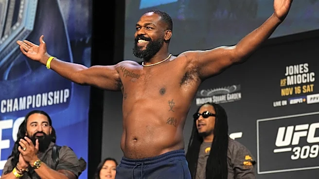 Jon Jones reacts to Kamaru Usman picking Brock Lesnar to beat him in RAF wrestling match