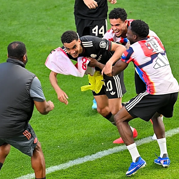 Bayern Munich’s Jamal Musiala gets mobbed following Mainz win