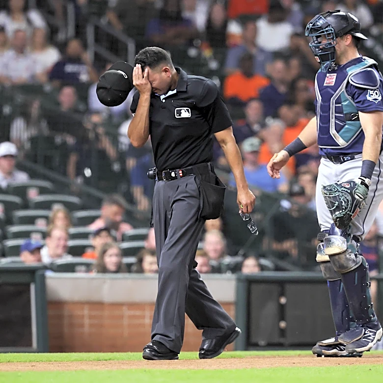 Mariners lose game, umpire, maybe Cal Raleigh in extras