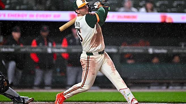 Orioles overcome Tigers and torrential rain with 7-4 win