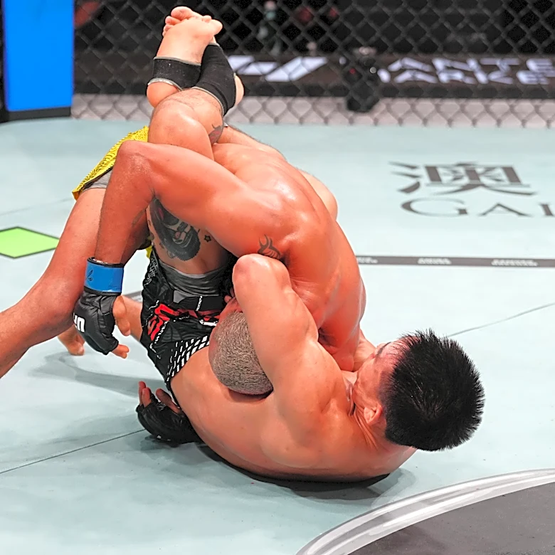 Song Yadong submits Deiveson Figueiredo with surprise guillotine choke in UFC Macau main event