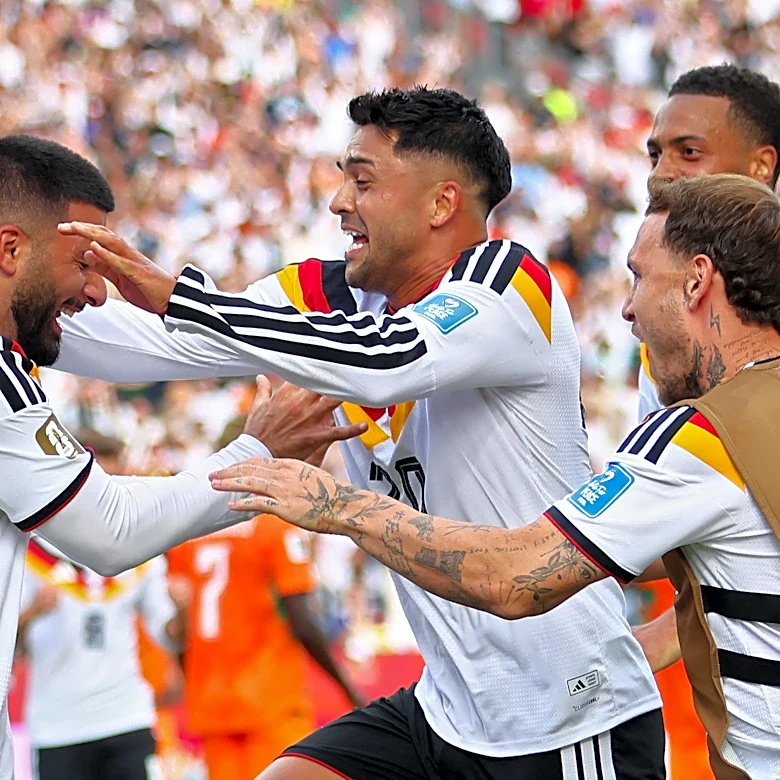 Germany secures place in knockout rounds for first time since lifting cup in 2014