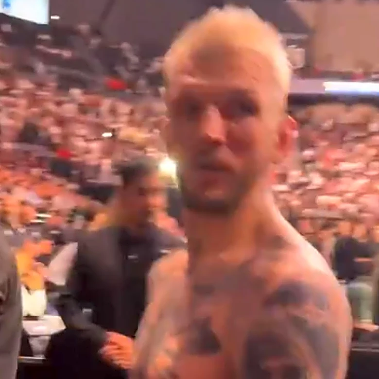 Video: Security holds Dan Hooker back as French fans mock ‘The Hangman’