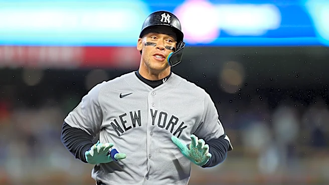 Yankees clinch playoff berth, beat Twins