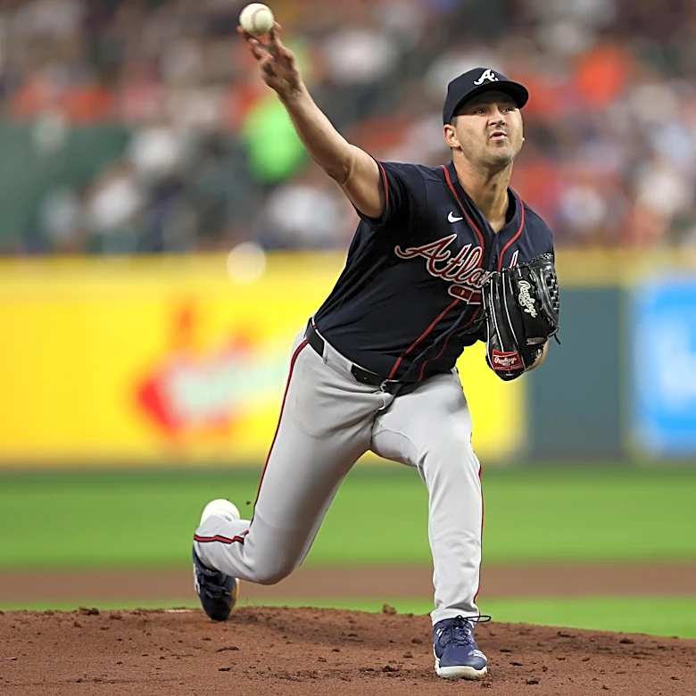 Braves clinch postseason bid with three homers in win over Astros