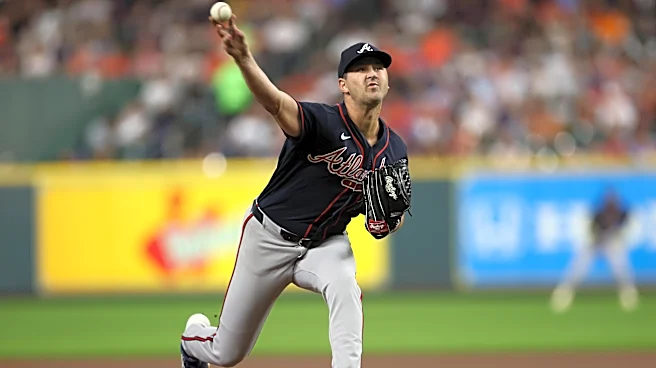 Braves clinch postseason bid with three homers in win over Astros
