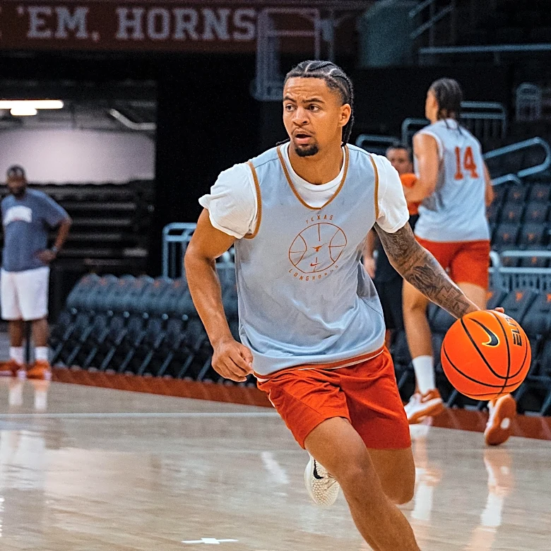 Texas G Mikey Lewis fractured his foot in practice