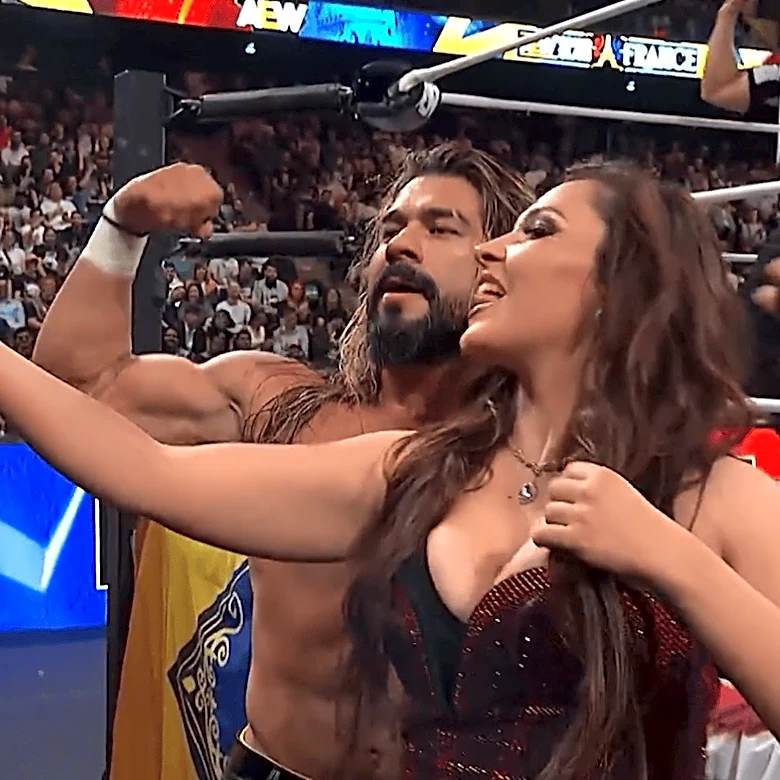Andrade receives a kiss from his next title challenger