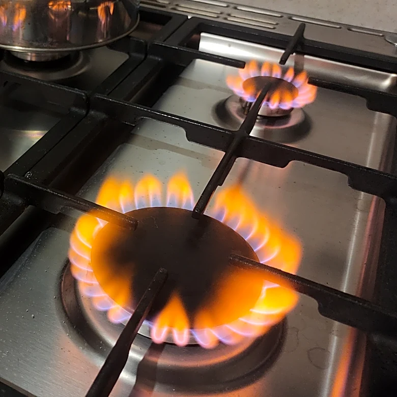 Orange Flames On Your Gas Stove? Here's The First Step You Should Take