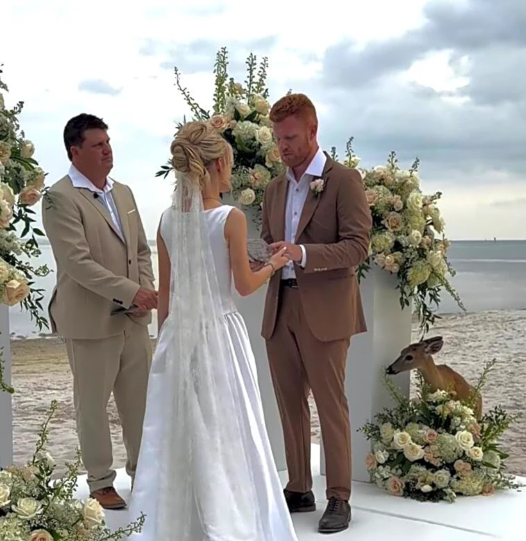 Couple's Romantic Beach Wedding Gets Interrupted By A Hungry Deer