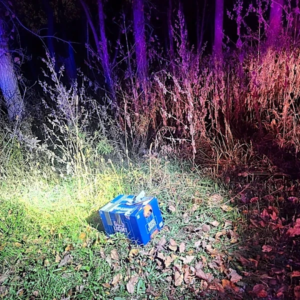 Officer Follows Barking To A Taped-Up Beer Box With A Tiny Nose Poking Out