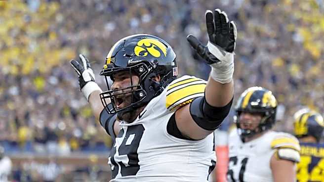 Iowa staggers Michigan on touchdown pass as time expires