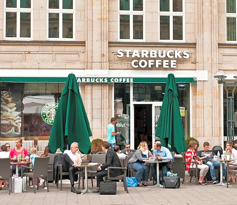 Starbucks cuts more jobs as $2 billion turnaround expands