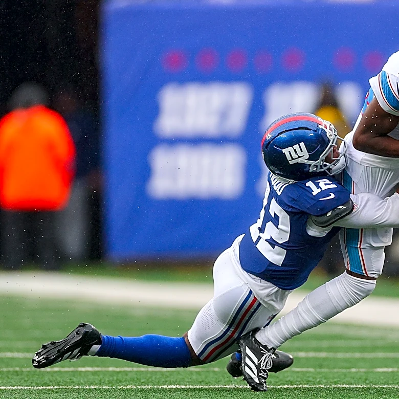 Who were the highest and lowest graded players in the Titans' loss?