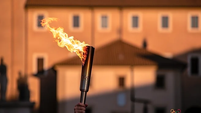 Snoop Dogg Carries Olympic Torch in Italy as Team USA's Honorary Coach