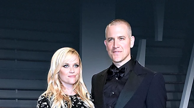 Reese Witherspoon and Oliver Haarmann Display Affection at 'Elle' Premiere