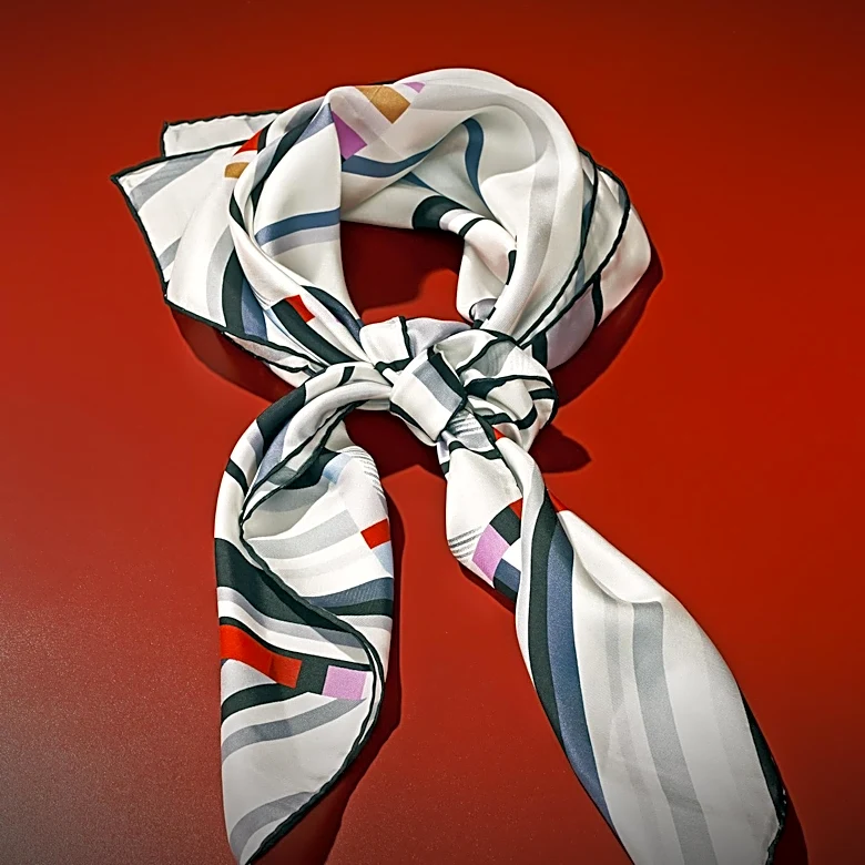 Pre-Fall 2026 Collections Highlight Silk Scarves and Lace Revival