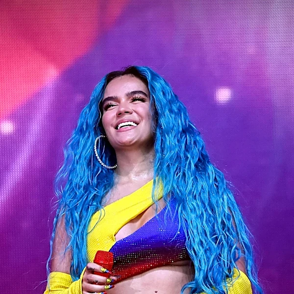 Karol G Releases New Album Featuring Bruno Mars and Drake, Showcasing Emotional Depth
