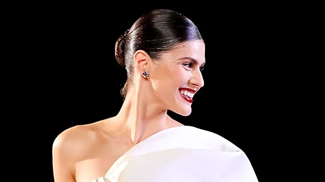 Anne Hathaway's Red Carpet Maternity Fashion Sparks Debate